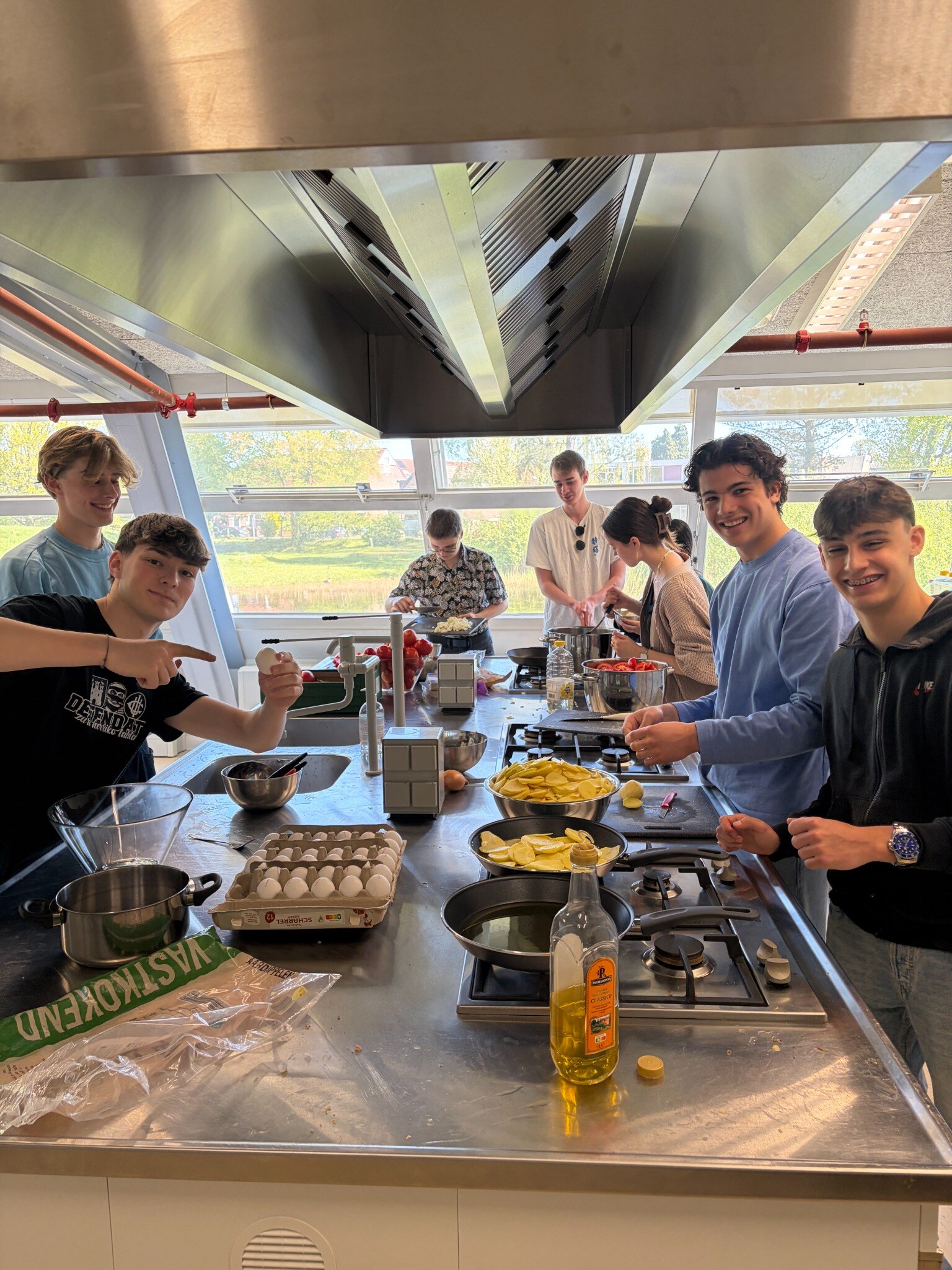 Students preparing food together in a training kitchen